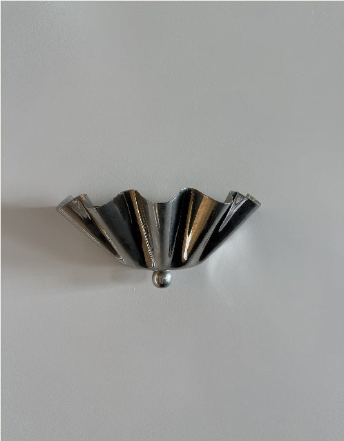 Sculptural metal wall light in the L'eto Northern Beaches studio