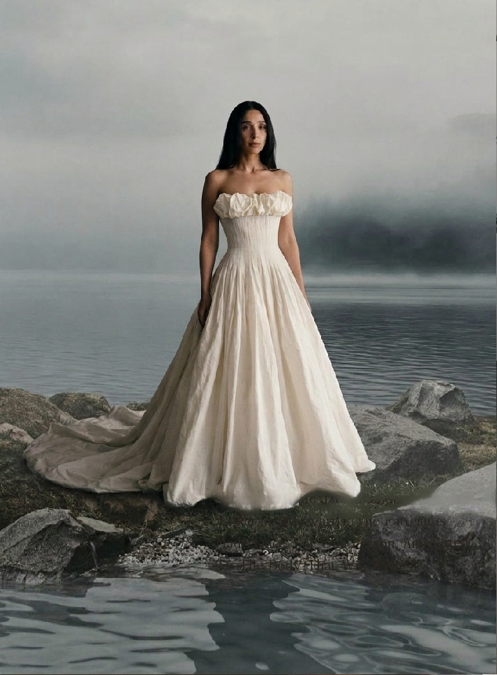 Tender 2025 wedding dress with a full skirt, worn by the water